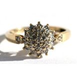 A yellow metal diamond cluster ring, approx UK size 'N'.