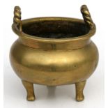 A Chinese censer with two rope twist handles standing on three legs. 9cm (3.5ins) diameter