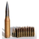 A 30mm inert shell; together with a chain of .308mm bullets.