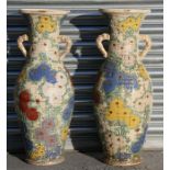 A pair of late 19th century Japanese Satsuma two-handled floor vases decorated with chrysanthemums