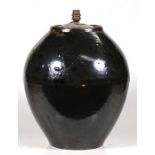 A Chinese glazed storage jar (converted to a table lamp), 43cms (17ins) high.