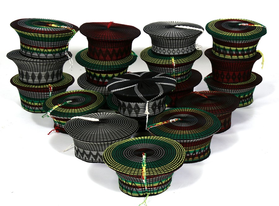 A group of nineteen traditional hand woven South African Zulu Isicholo hats (19)..