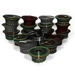A group of nineteen traditional hand woven South African Zulu Isicholo hats (19)..
