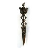 A Tibetan bronze Pheurbei or Buddhist ritual dagger with mask head handle and horse head terminal