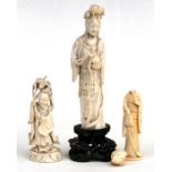 A late 19th century Chinese ivory figure in the form of Guanyin on pierced hardwood stand, 23cms (