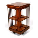 A burr walnut revolving bookcase, 46cms (18ins) wide.