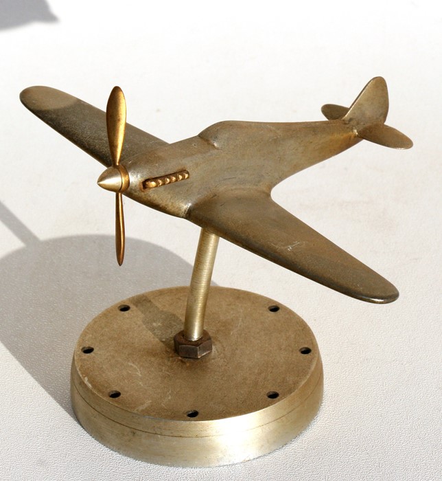 A chrome plated model of the WW2 Hawker Hurricane standing on a metal base. Wingspan 16cms (6.