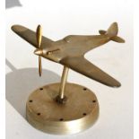 A chrome plated model of the WW2 Hawker Hurricane standing on a metal base. Wingspan 16cms (6.