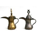 A Turkish / Islamic brass dallah coffee pot, 32cms (12.5ins) high; together with another tinned