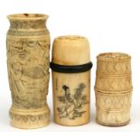 A Japanese Meiji Period bone vase decorated with figures, 10cms (4ins) high; together with a bone