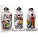 A group of three modern Chinese reverse painted snuff bottles, 8cms (3.1ins) high.