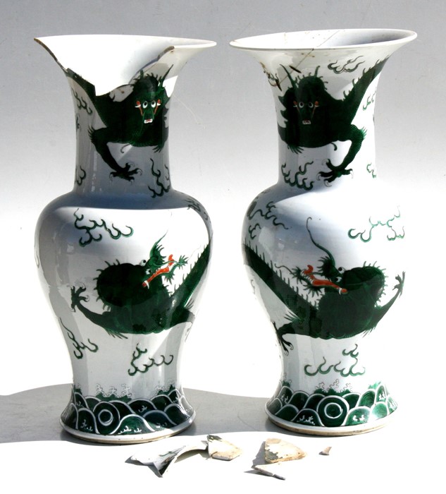 A pair of 19th century Chinese famille verte vases decorated with dragons chasing a flaming pearl,