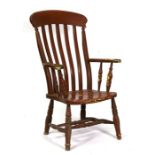 A Victorian painted pine Windsor armchair.