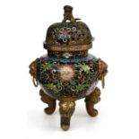 A Chinese cloisonne censer with lion mask handles and fo dog finial, on three lion capped legs,