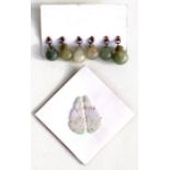 A pair of Chinese carved jade earring drops, 4cms (1.5ins) high; together with a set of six jade and