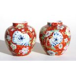 A pair of early 20th century sgraffito & famille rose vases, 7cms (2.75ins) high.Condition