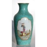 A Chinese famille rose vase decorated with figure within panels on a turquoise ground, red seal mark