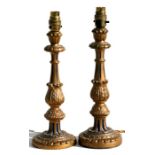 A pair of gilt wood table lamps, 31cms (12.25ins) high.