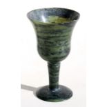 A mottled jade / hardstone goblet, 10cms (4ins) high.Condition Report 2cm chip to upper rim.