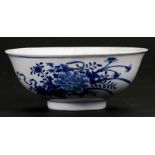 A 19th century blue & white bowl decorated with flowers, four character blue mark to underside,