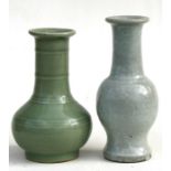 A Chinese celadon glazed vase, 16.5cms (6.5ins) high; together with another similar (2).Condition