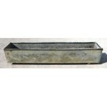 A large galvanised rectangular trough or planter, 246cms (97ins) long