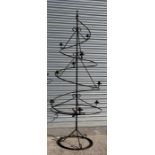 A wrought iron Christmas candle display stand.