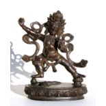 A Tibetan bronze figure in the form of a deity, 25cms (9.75ins) high.