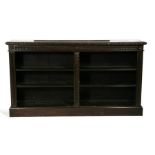 A Victorian carved oak open double bookcase, on plinth base, 181cms (71.25ins) wide.