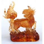 A 20th century Chinese amber Peking glass dragon, 26cms (10.25ins) high.