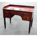 A Victorian mahogany washstand, the galleried top above a single frieze drawer with two short