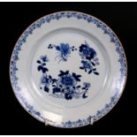 A 19th century Chinese blue& white plate decorated with flowers, 23cms (9ins) diameter.Condition