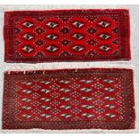 A handmade Persian Baluch rug with geometric design on a red ground, 105 by 50cms (41 by 19.5ins);
