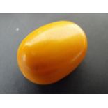 Fourteen loose butterscotch amber beads, the largest bead 4cms (1.57ins) wide.Condition ReportWeight