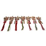 A group of seven Chinese silk and bullion wire embroidered tassels depicting robed figures riding