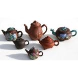 A group of Six Chinese Yixing pottery teapots, the largest 14cms (5.5ins) high (6).Condition