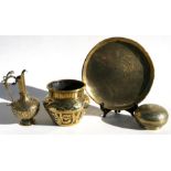 An Islamic brass pot decorated with calligraphy; together with an Indian brass ewer and similar