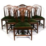 A set of six Georgian mahogany dining chairs with pierced splats, on square tapering legs (five plus
