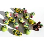 A group of Chinese glazed pottery altar fruit including peach, passion fruit and Buddha's hand,