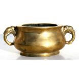 A Chinese bronze censer with elephant head handles, six-character mark to underside, 15cms (6ins)