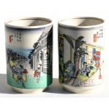 A pair of Japanese Satsuma brush pots decorated with figures & calligraphy, 9cms (3.5ins) high.