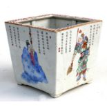 A Chinese famille rose square form planter decorated with figures and calligraphy, 19cms (7.5ins)