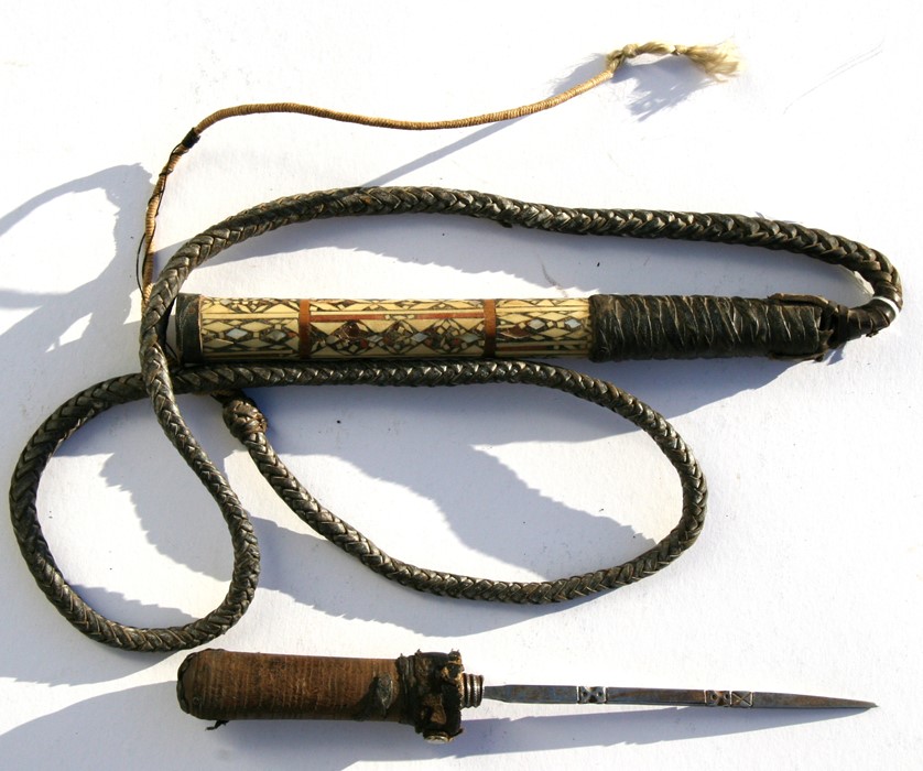 A camel whip with concealed stiletto dagger in the handle