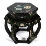 A Chinese lacquer hexagonal drum table decorated with birds and flowers on a black ground, 46cms (