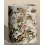 A Chinese famille rose brush pot decorated with prunus, 9cms (3.5ins) high.Condition ReportGood