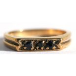 A 9ct gold dress ring set with three sapphires, approx UK size 'K'.