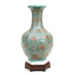 A Chinese hexagonal form vase decorated with blossom and foliate scrolls, on a hardwood stand, 38cms