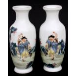 A pair of Chinese Republic vases decorated with a figure in a landscape, four character mark to