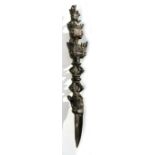 A Tibetan bronze Pheurbei or Buddhist ritual dagger with multiple mask head handle and triform