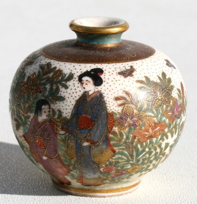 A late 19th century Meiji Period miniature Satsuma vase of globular form decorated with figures &